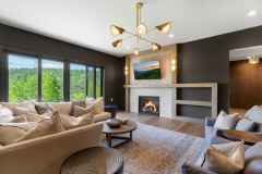 atelier-maison-casa-bonita-california-mountain-ranch-the-cliffs-mountain-park-marietta-sc-design-services-lower-level-living-room-dark-walls-fireplace-tv-10